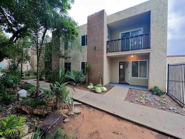 exterior space featuring a patio and a balcony