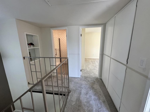 hallway featuring carpet flooring