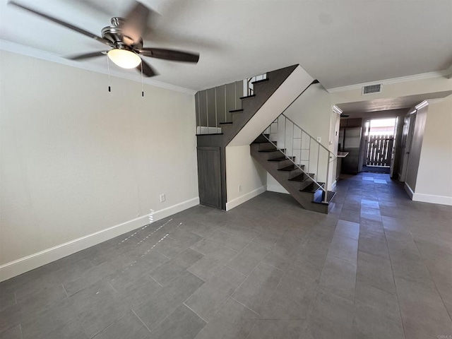 interior space featuring ceiling fan and crown molding