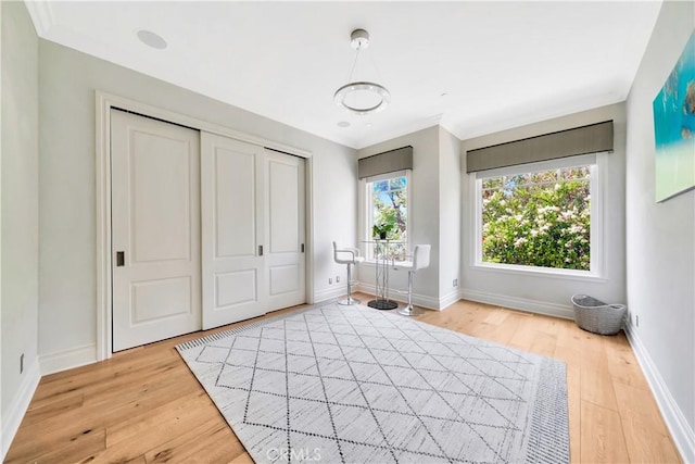 unfurnished bedroom featuring a closet and light hardwood / wood-style floors