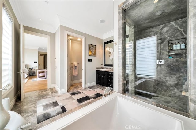 bathroom with hardwood / wood-style flooring, vanity, a healthy amount of sunlight, and ornamental molding