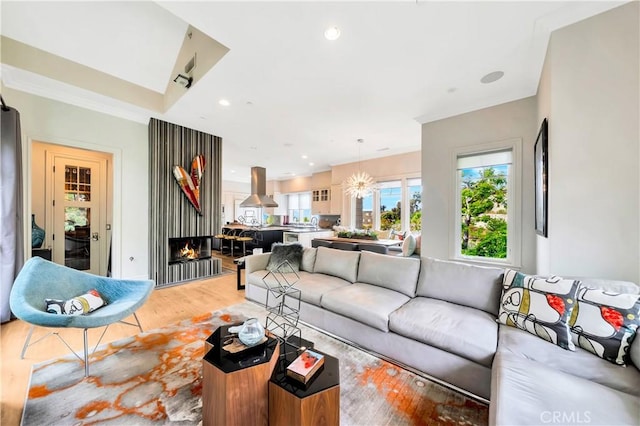 living room featuring hardwood / wood-style floors and a notable chandelier