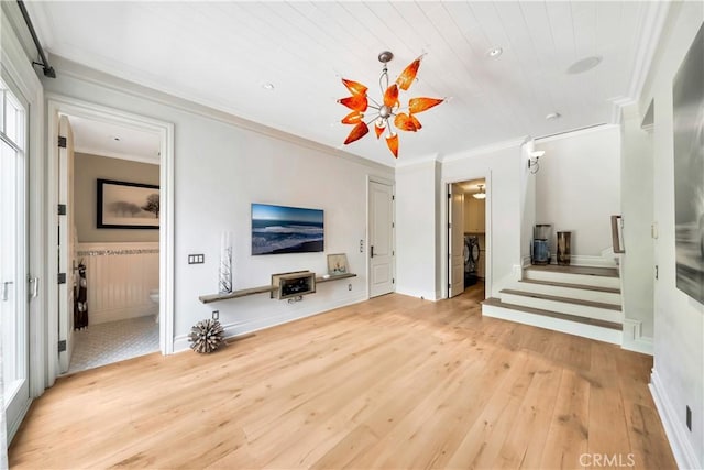 living room with crown molding and hardwood / wood-style floors