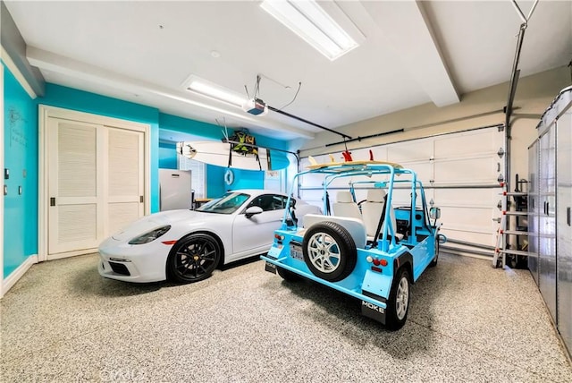 garage with white fridge and a garage door opener