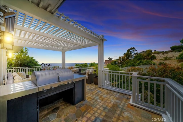 view of patio terrace at dusk