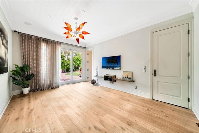 unfurnished living room with light hardwood / wood-style floors and crown molding