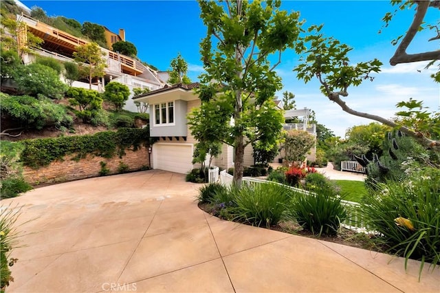 mediterranean / spanish house featuring a garage