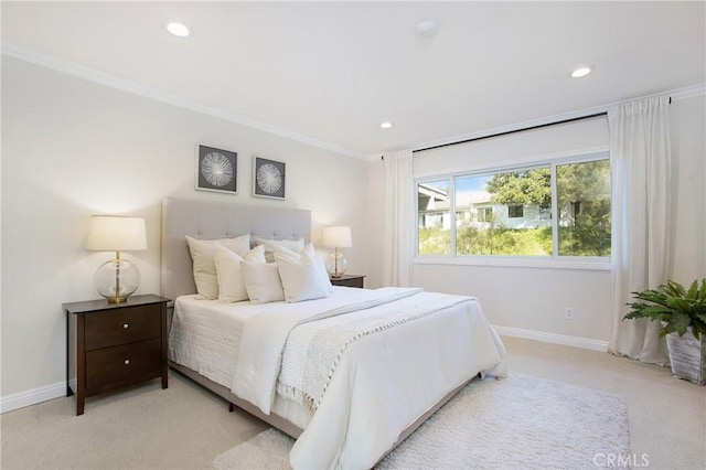 bedroom featuring ornamental molding and light carpet