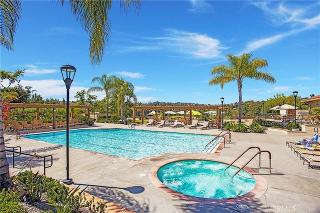 view of swimming pool with a pergola, a community hot tub, and a patio