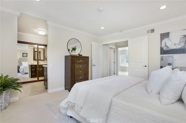 carpeted bedroom featuring ensuite bathroom and crown molding