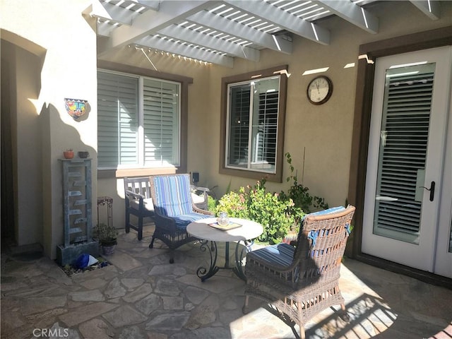 view of patio featuring a pergola