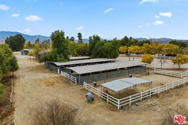 drone / aerial view featuring a mountain view and a rural view