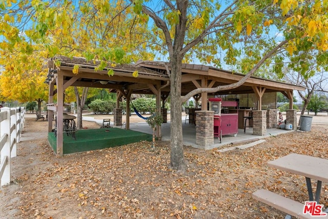 view of community featuring an outdoor bar