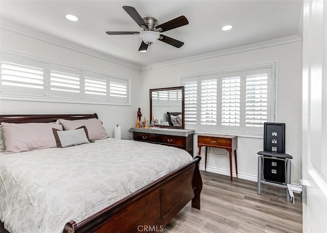 bedroom with light wood-type flooring, ceiling fan, and crown molding