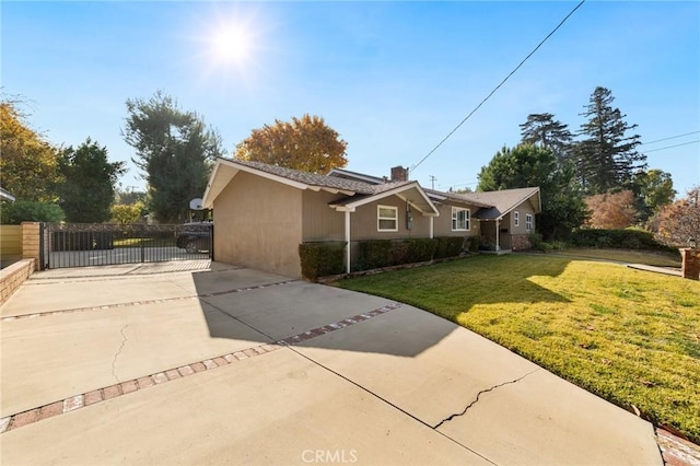 view of side of home featuring a yard