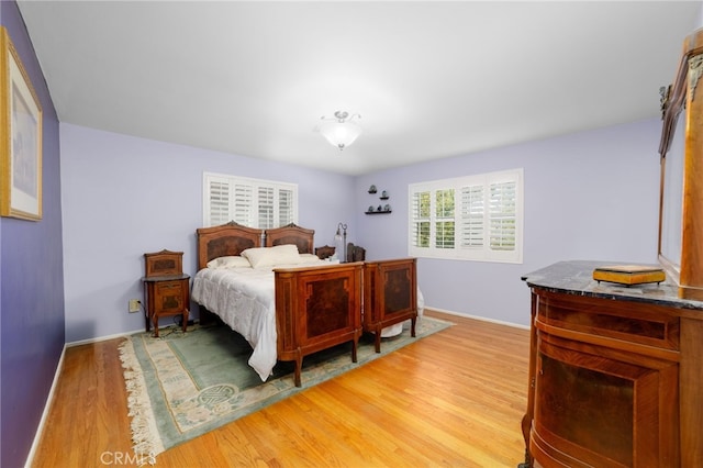 bedroom featuring wood-type flooring