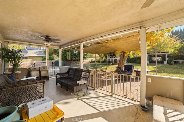 view of patio / terrace featuring an outdoor living space and ceiling fan