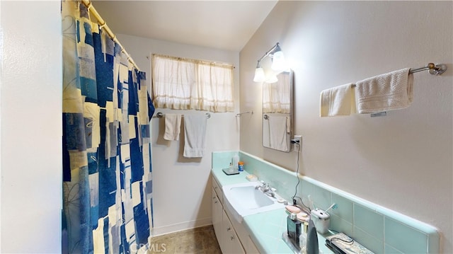 bathroom with vanity and walk in shower