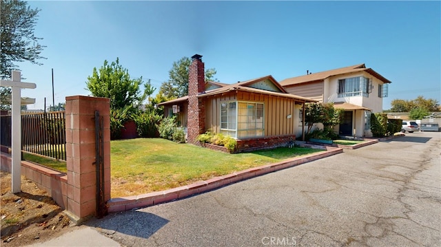 view of home's exterior with a lawn