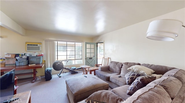 living room featuring carpet and a wall unit AC