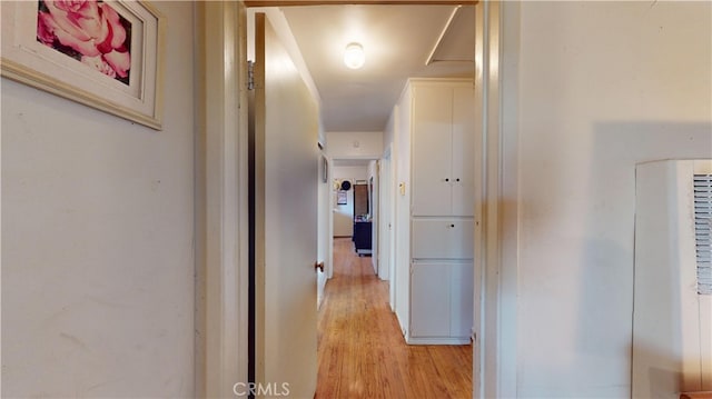 corridor featuring light hardwood / wood-style floors