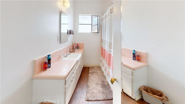 bathroom featuring hardwood / wood-style floors and vanity