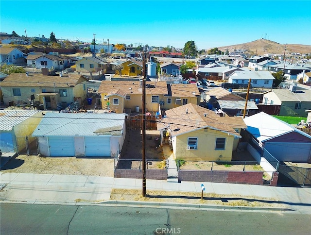 birds eye view of property featuring a mountain view