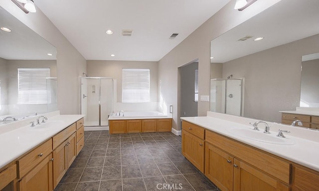 bathroom with separate shower and tub, tile patterned flooring, and vanity