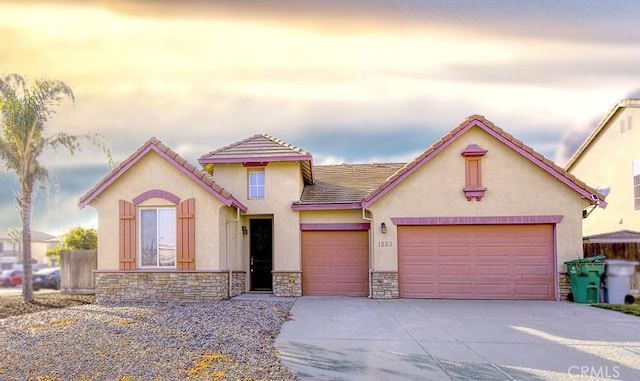 mediterranean / spanish-style home featuring a garage