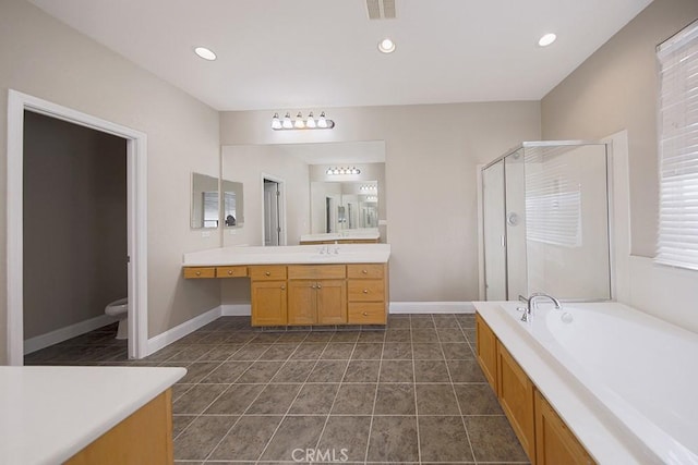 full bathroom featuring tile patterned floors, plus walk in shower, vanity, and toilet