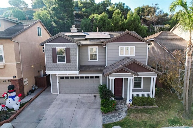 view of front of house with solar panels and a garage