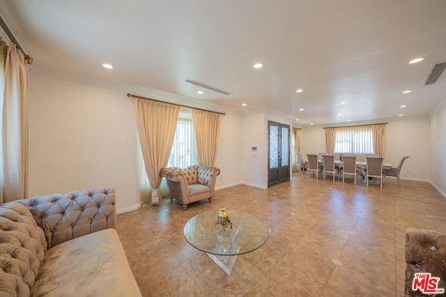 living room featuring crown molding