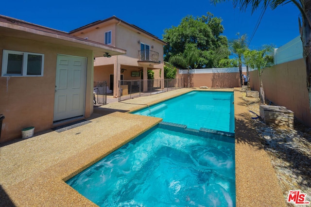 view of pool featuring a patio