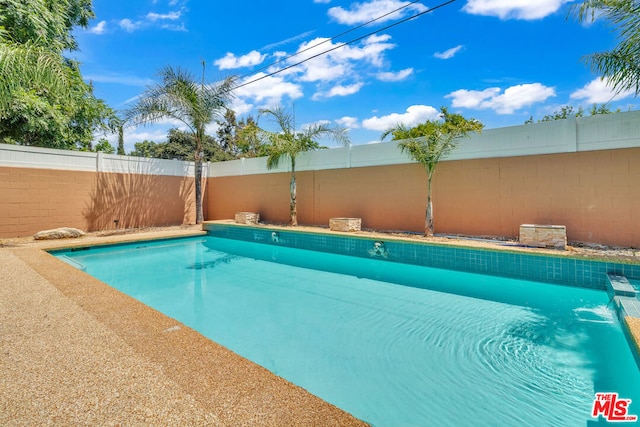 view of pool featuring pool water feature