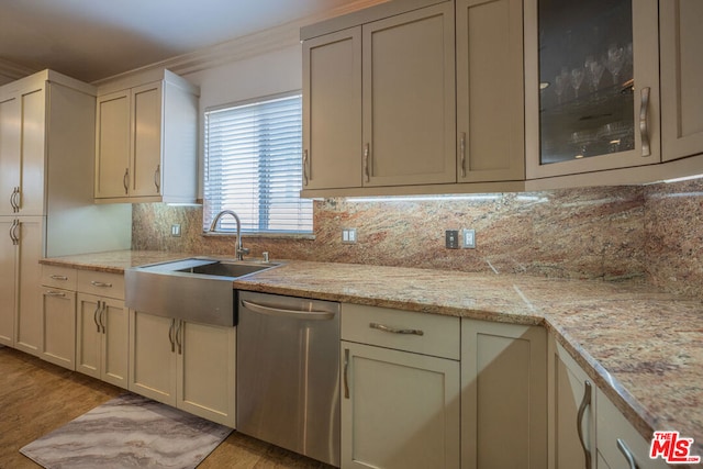 kitchen featuring dishwasher, tasteful backsplash, light hardwood / wood-style floors, sink, and crown molding