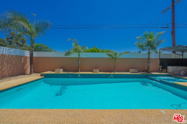 view of pool featuring a hot tub