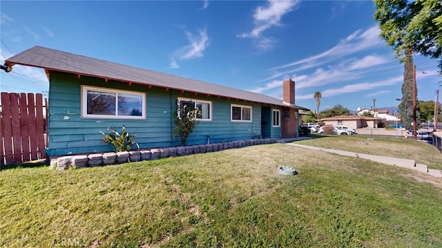 ranch-style house with a front lawn