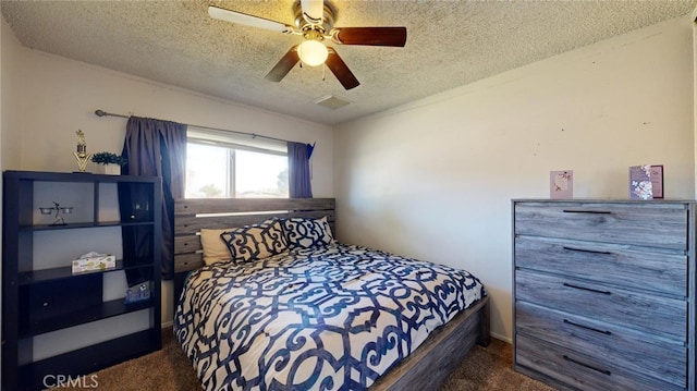 carpeted bedroom with ceiling fan and a textured ceiling