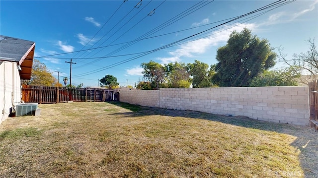 view of yard featuring central AC unit