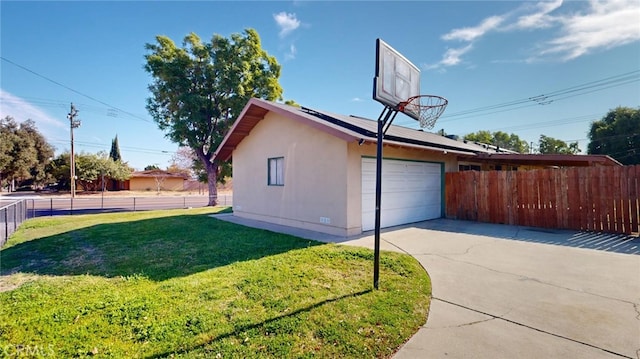 view of basketball court with a lawn