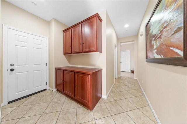 corridor with light tile patterned flooring