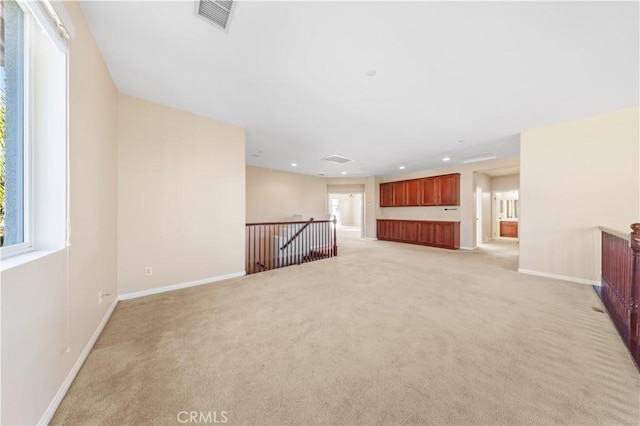 spare room with light colored carpet