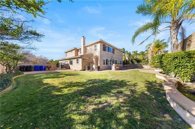 rear view of property with a yard