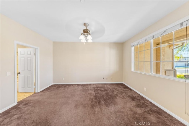 unfurnished room with carpet floors and ceiling fan