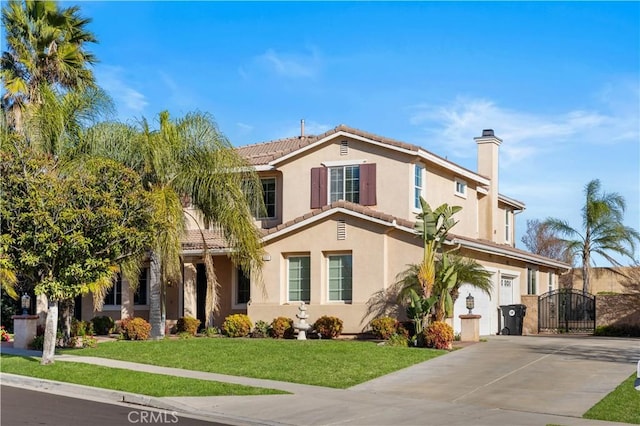 view of front of home featuring a front yard and a garage