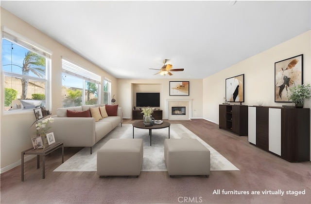 living room with ceiling fan and light colored carpet