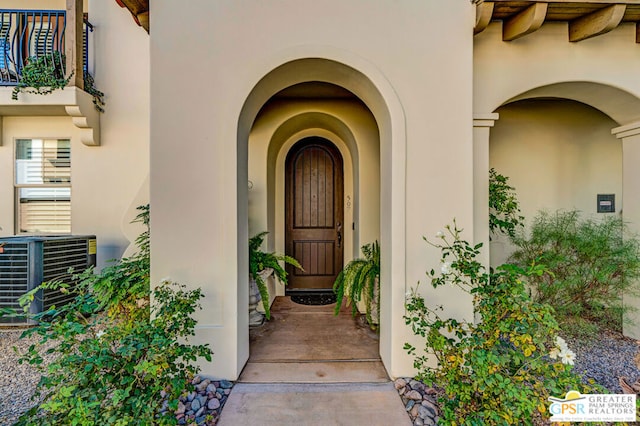 property entrance featuring central AC unit