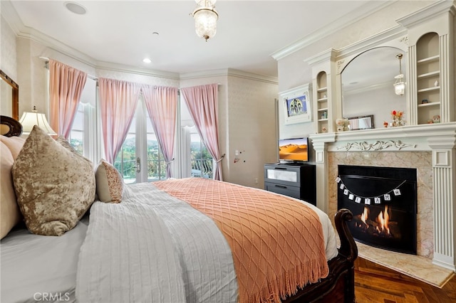 bedroom featuring dark hardwood / wood-style flooring, access to outside, and crown molding