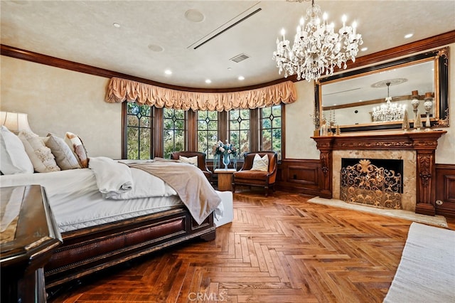 bedroom featuring parquet flooring, wooden walls, ornamental molding, and a premium fireplace