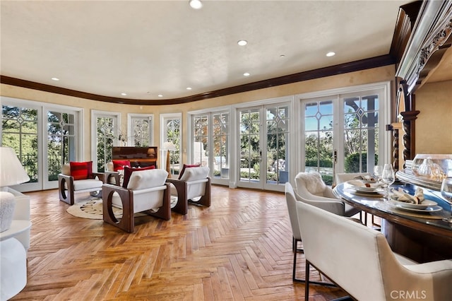 interior space featuring access to outside, multiple windows, french doors, and light parquet flooring